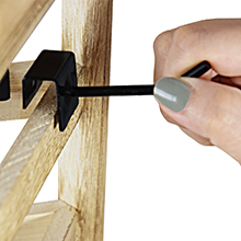 Edge of wooden rotating display rack with removable metal hook detail